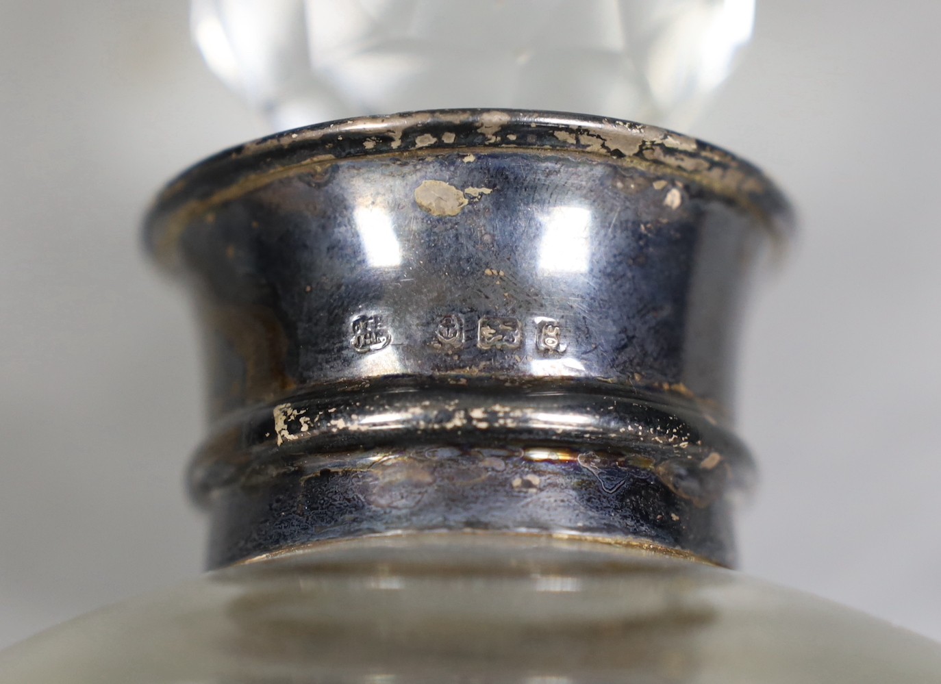 An Edwardian silver mounted waisted glass decanter and stopper, Hukin & Heath, Birmingham, 1906, height 28cm.